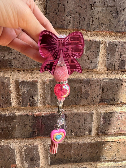 Pink bow badge